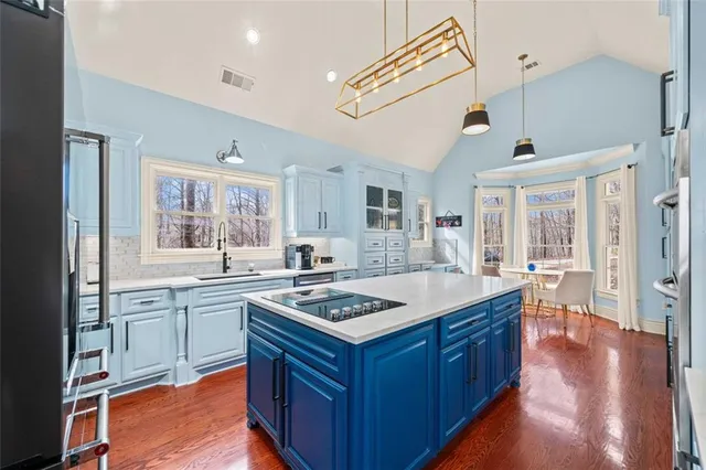 a bedroom with furniture and wooden floor