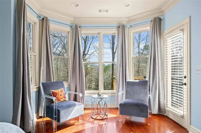 a view of balcony with wooden floor and iron stairs