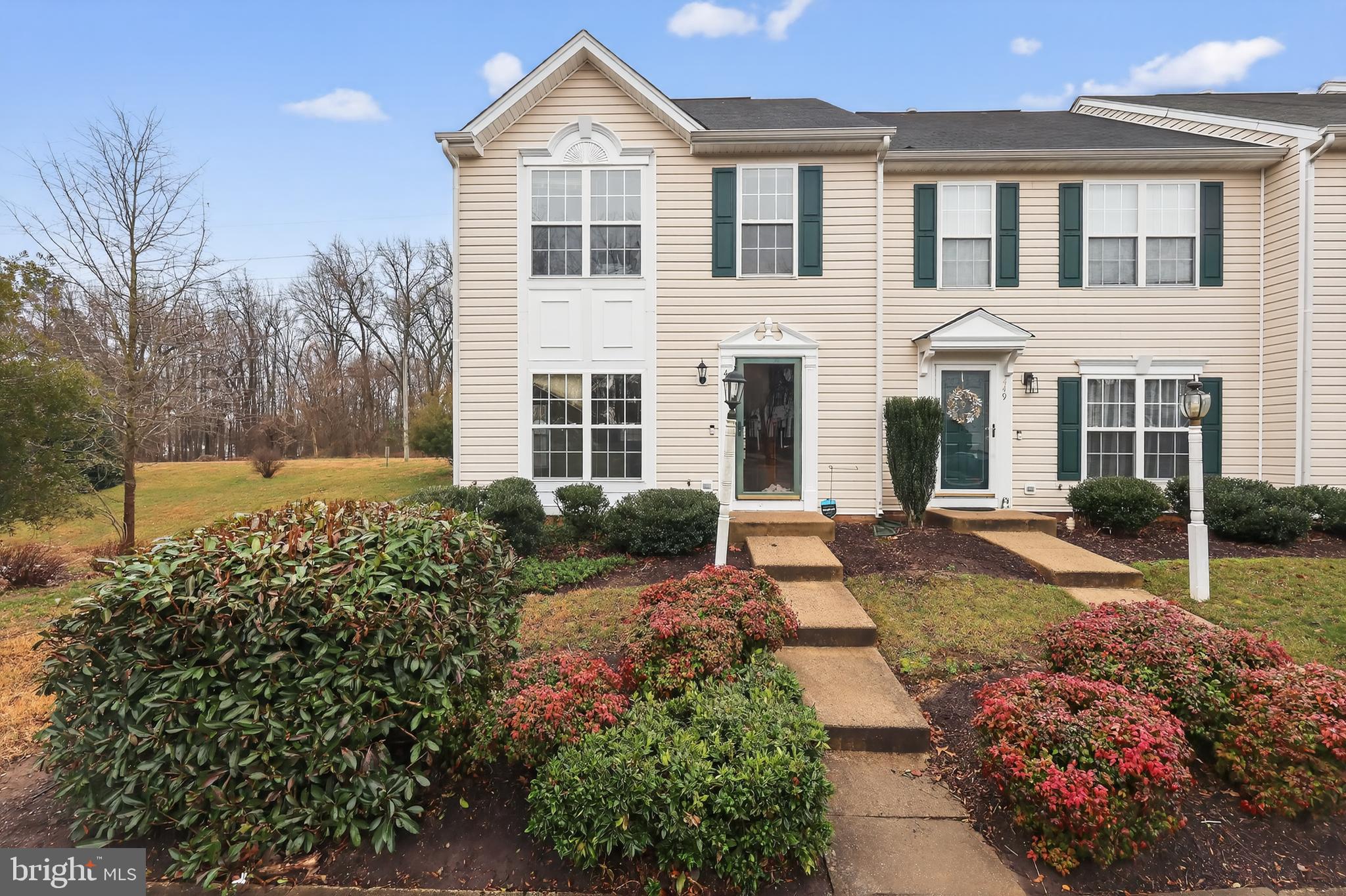 front view of a house with a yard