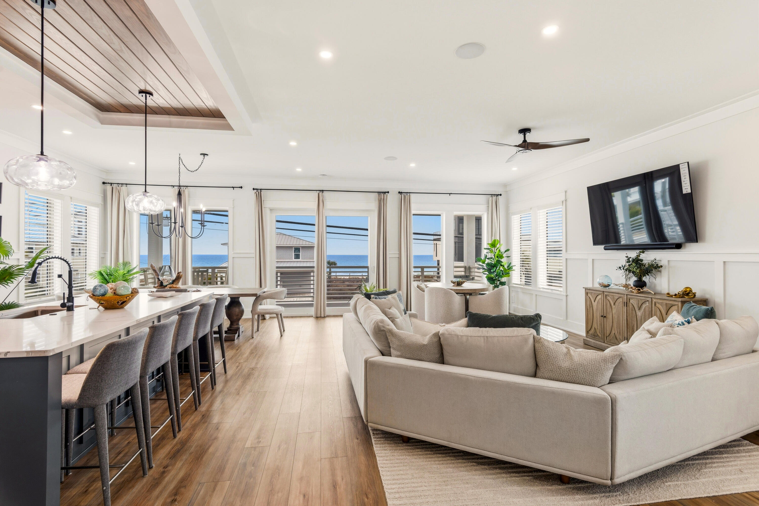 16416 Front Beach Road Panama City Beach, FL 32413 - Photo 1 of 46 a living room with furniture wooden floor and a flat screen tv