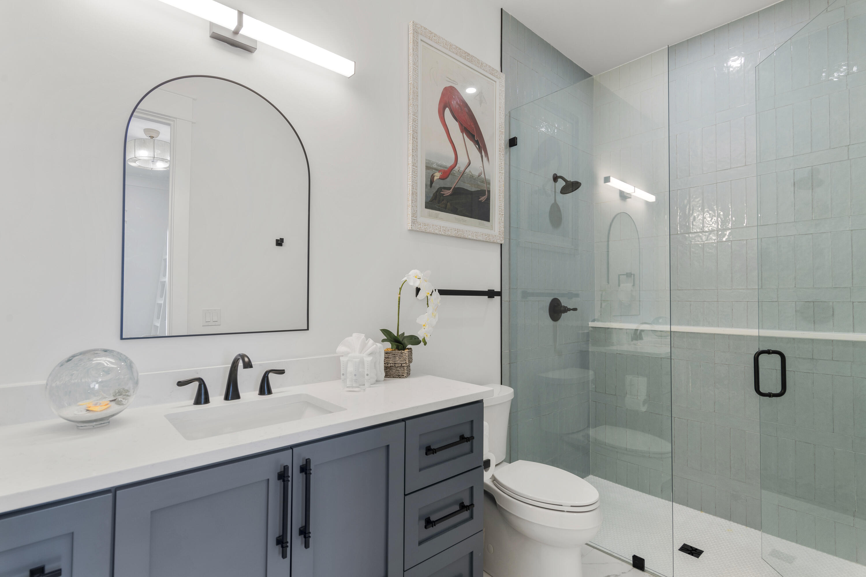 16416 Front Beach Road Panama City Beach, FL 32413 - Photo 20 of 46 a bathroom with a granite countertop sink a toilet and a mirror