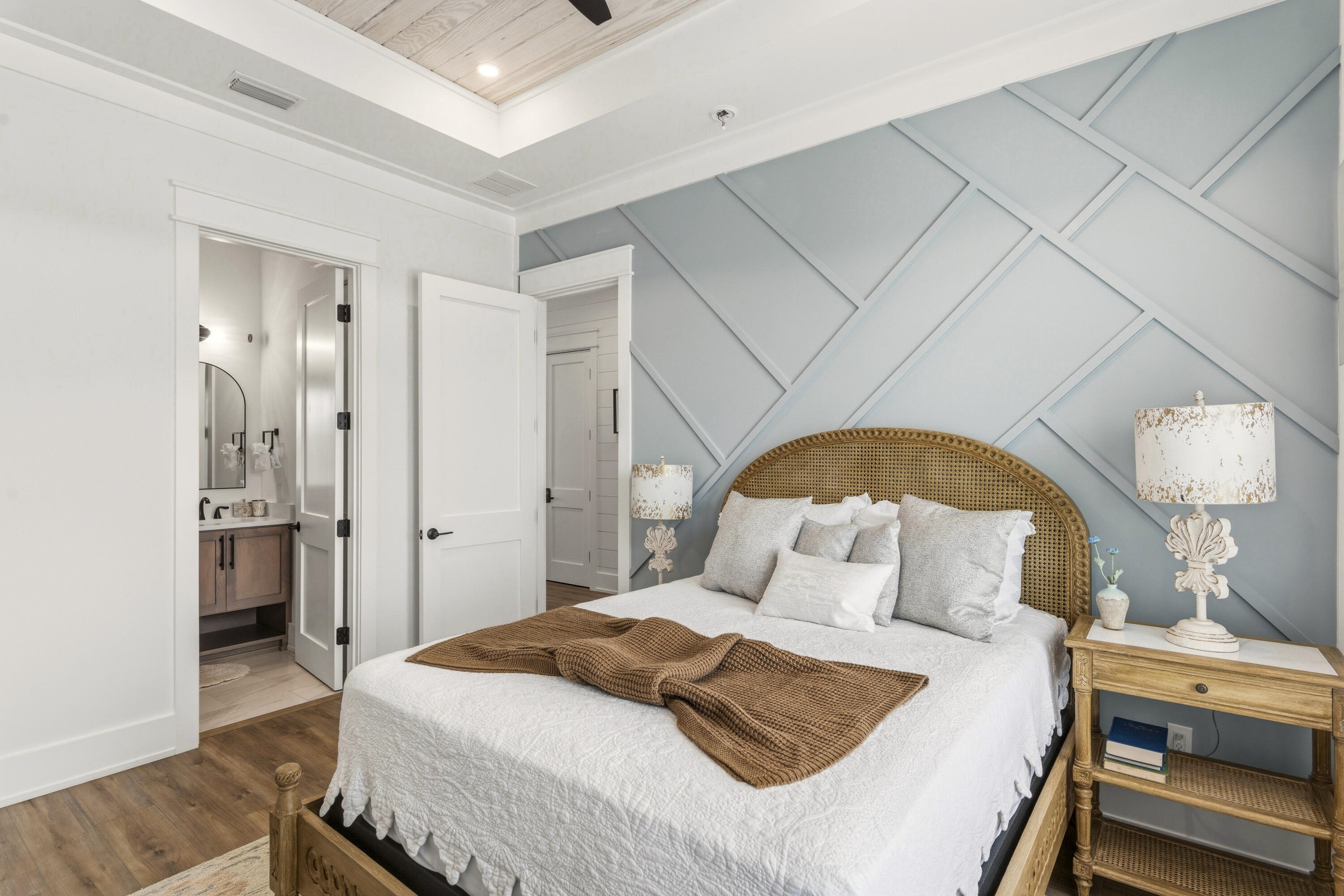 16416 Front Beach Road Panama City Beach, FL 32413 - Photo 22 of 46 a bedroom with a bed and a mirror