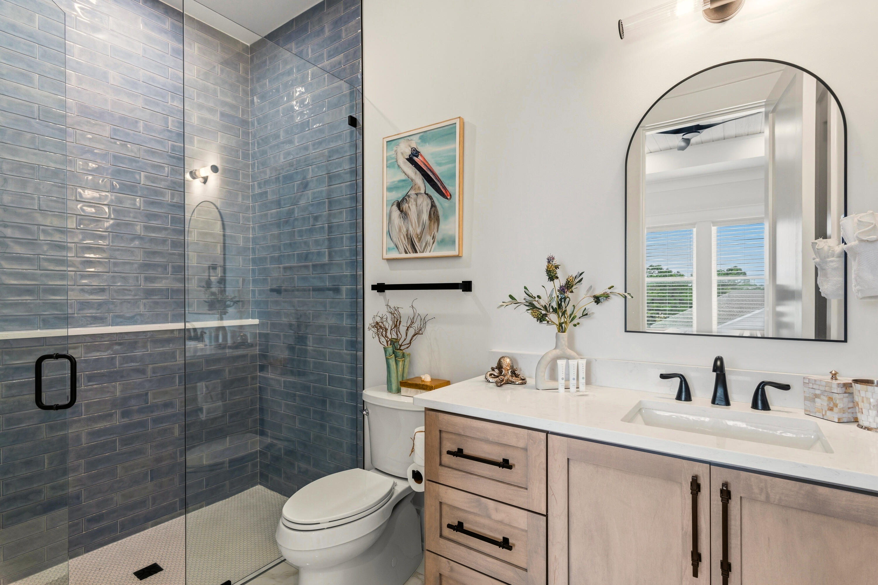 16416 Front Beach Road Panama City Beach, FL 32413 - Photo 23 of 46 a bathroom with a sink a toilet and a mirror