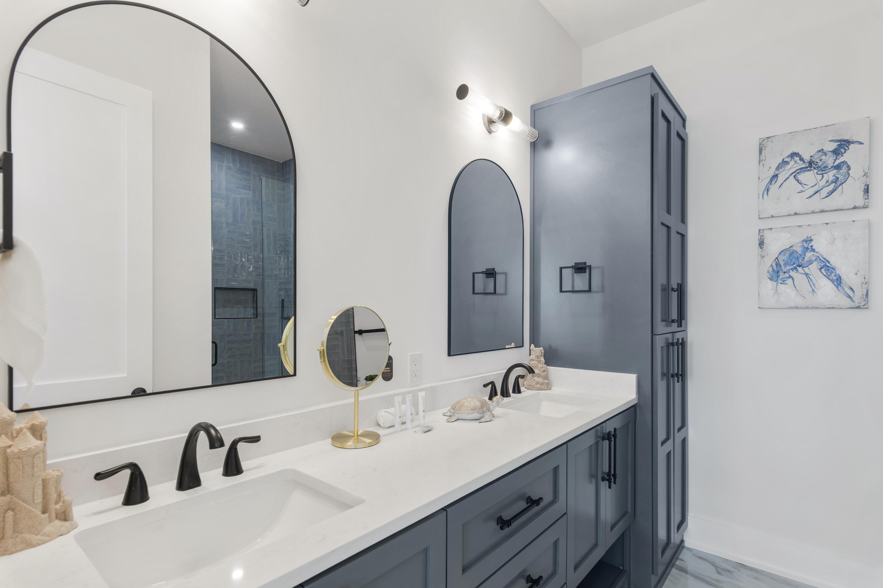 16416 Front Beach Road Panama City Beach, FL 32413 - Photo 28 of 46 a bathroom with a double vanity sink and a mirror