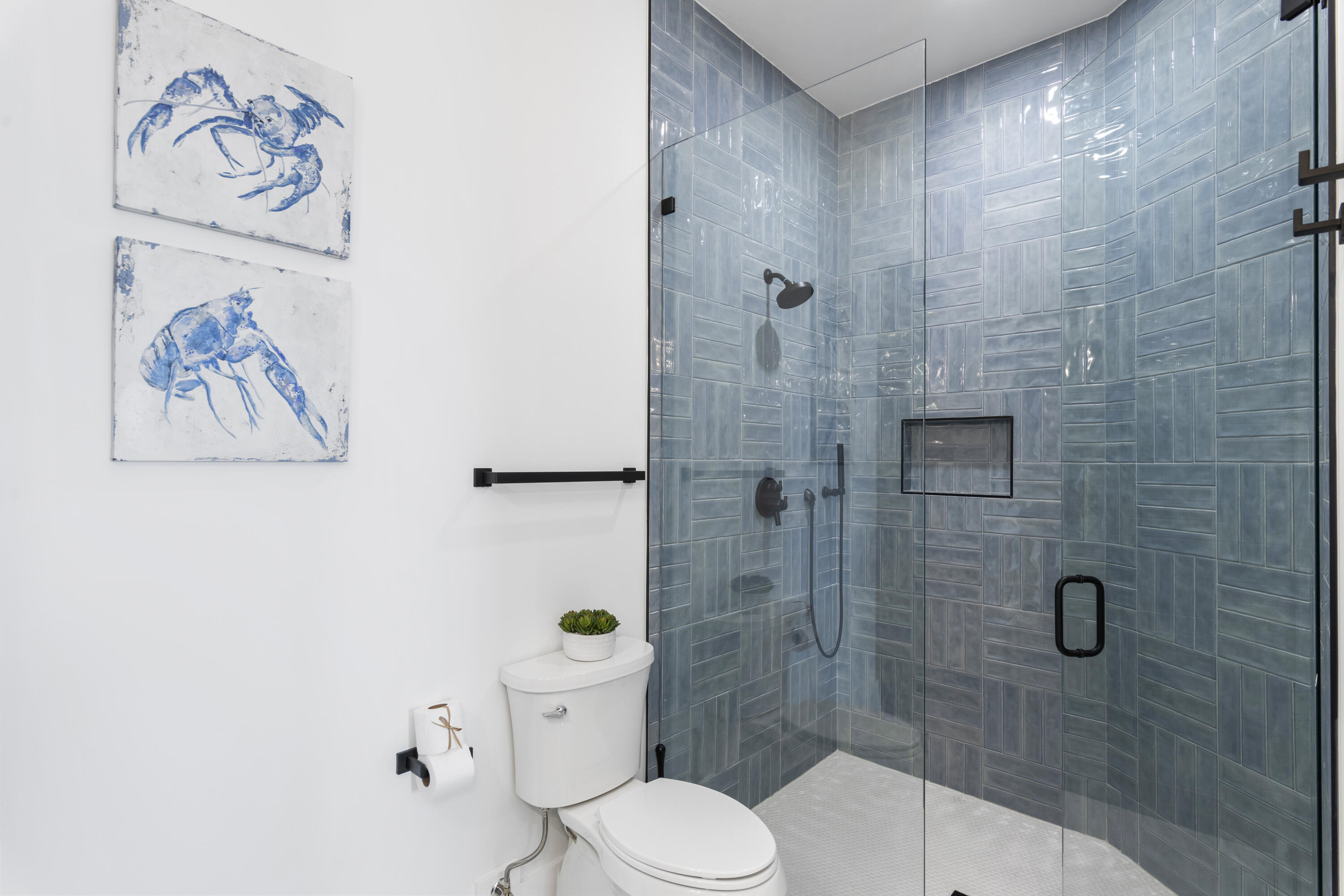 16416 Front Beach Road Panama City Beach, FL 32413 - Photo 29 of 46 a white toilet sitting next to a bathroom sink