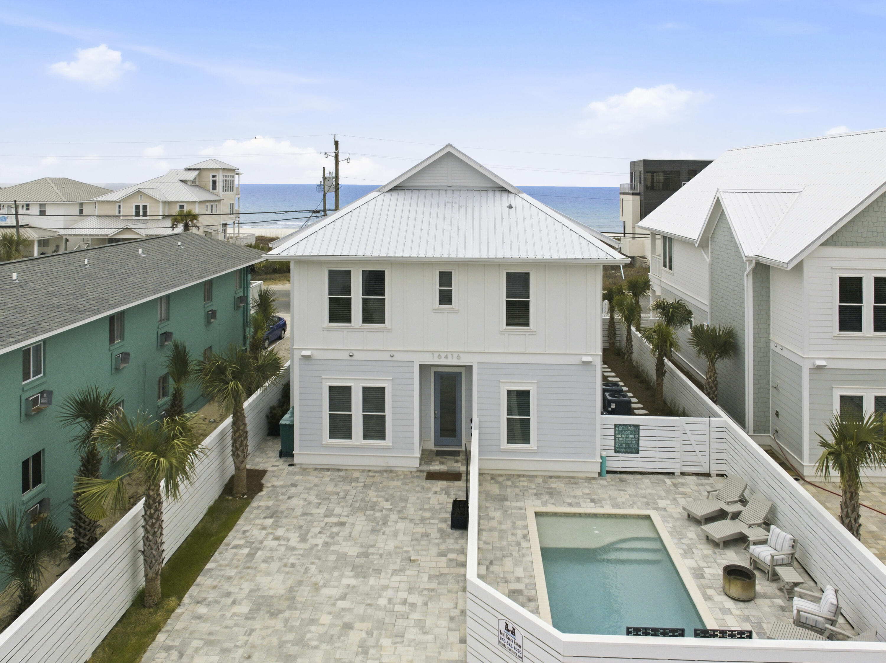 16416 Front Beach Road Panama City Beach, FL 32413 - Photo 3 of 46 a view of a house with a yard