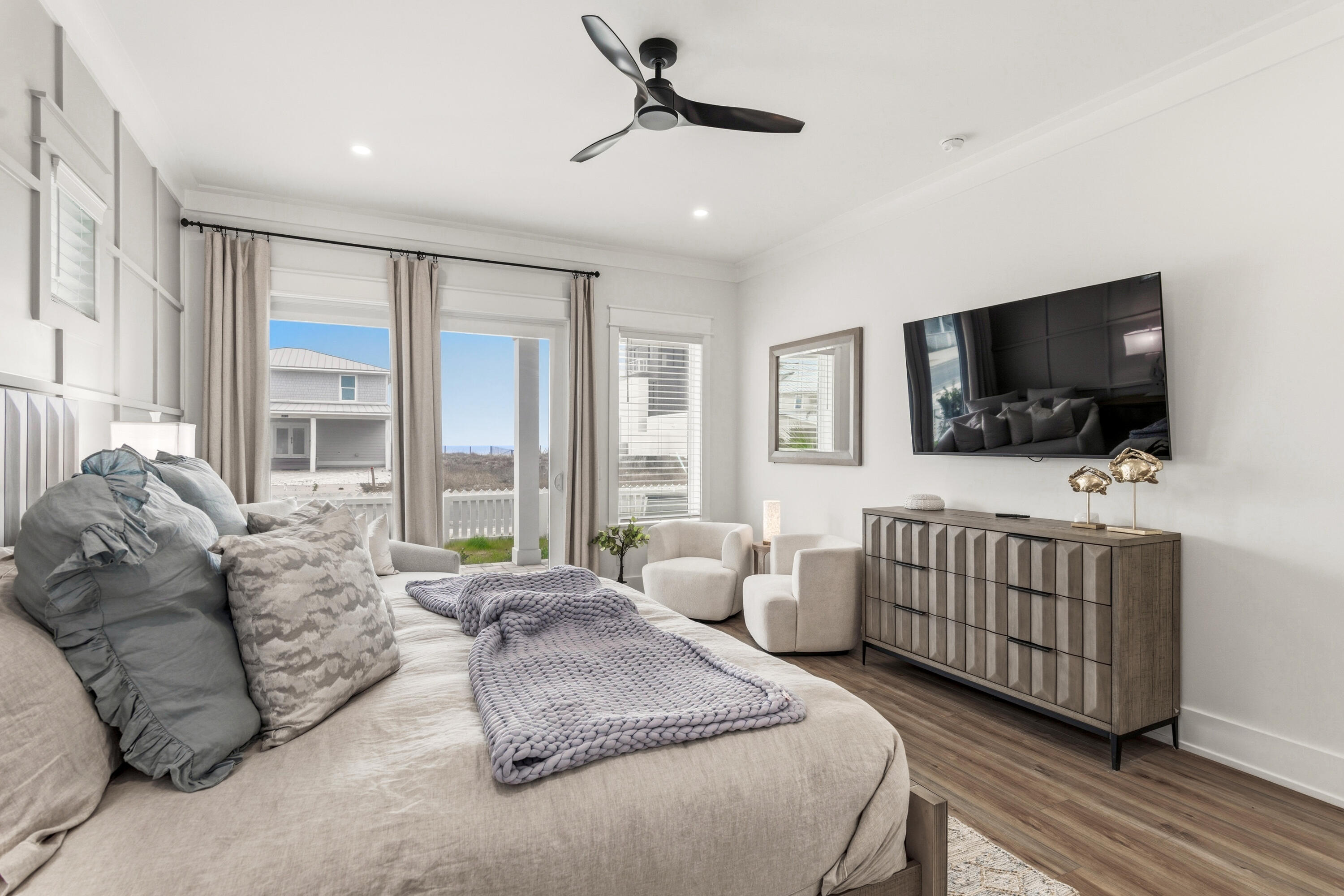 16416 Front Beach Road Panama City Beach, FL 32413 - Photo 31 of 46 a living room with furniture and a flat screen tv