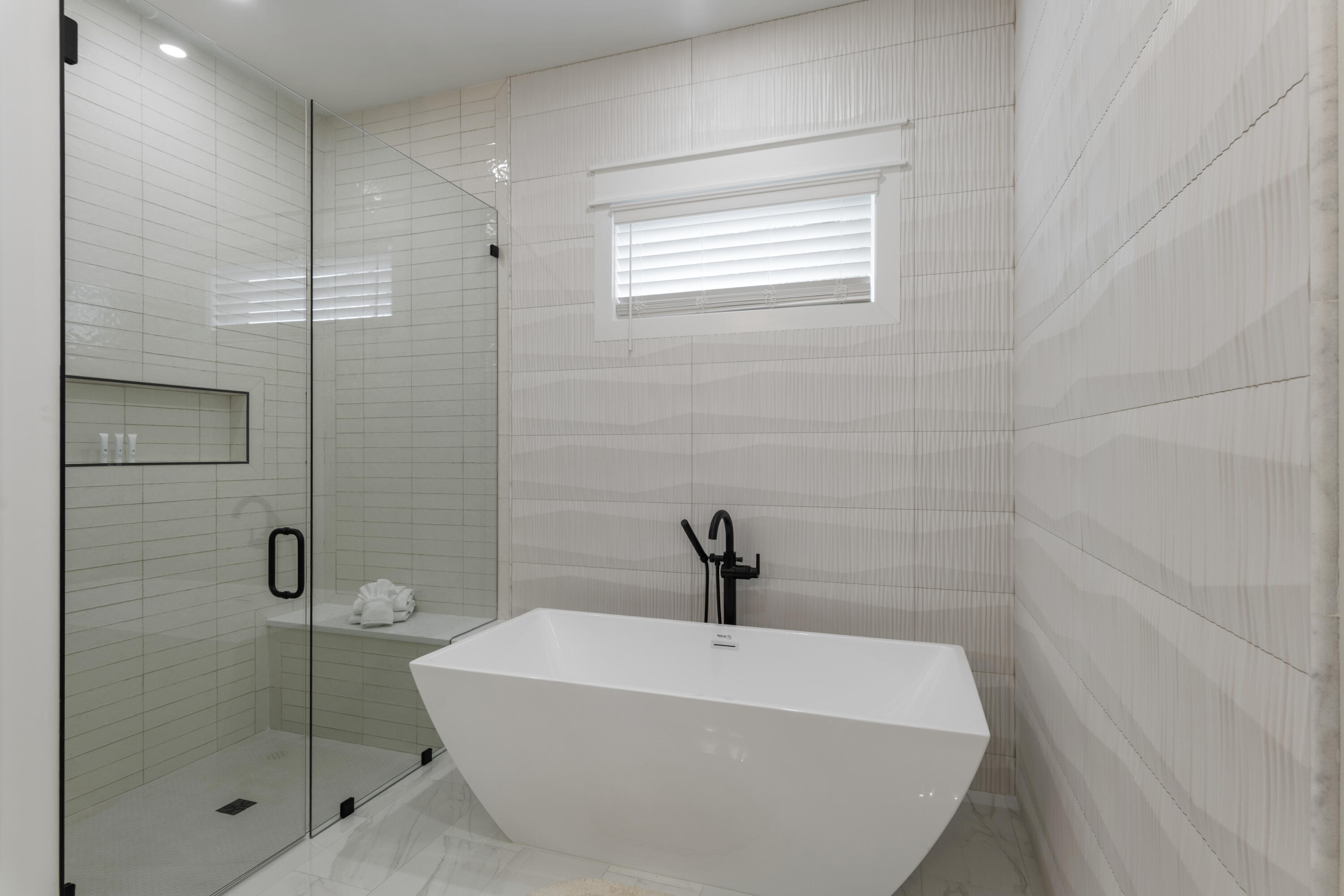 16416 Front Beach Road Panama City Beach, FL 32413 - Photo 34 of 46 a bathroom with a white bathtub
