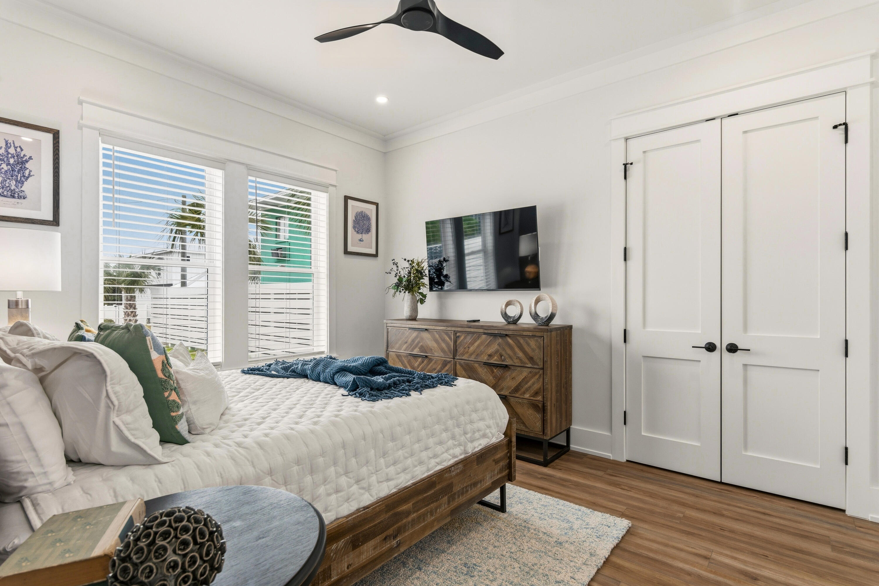 16416 Front Beach Road Panama City Beach, FL 32413 - Photo 38 of 46 a bedroom with a bed a window and a fireplace