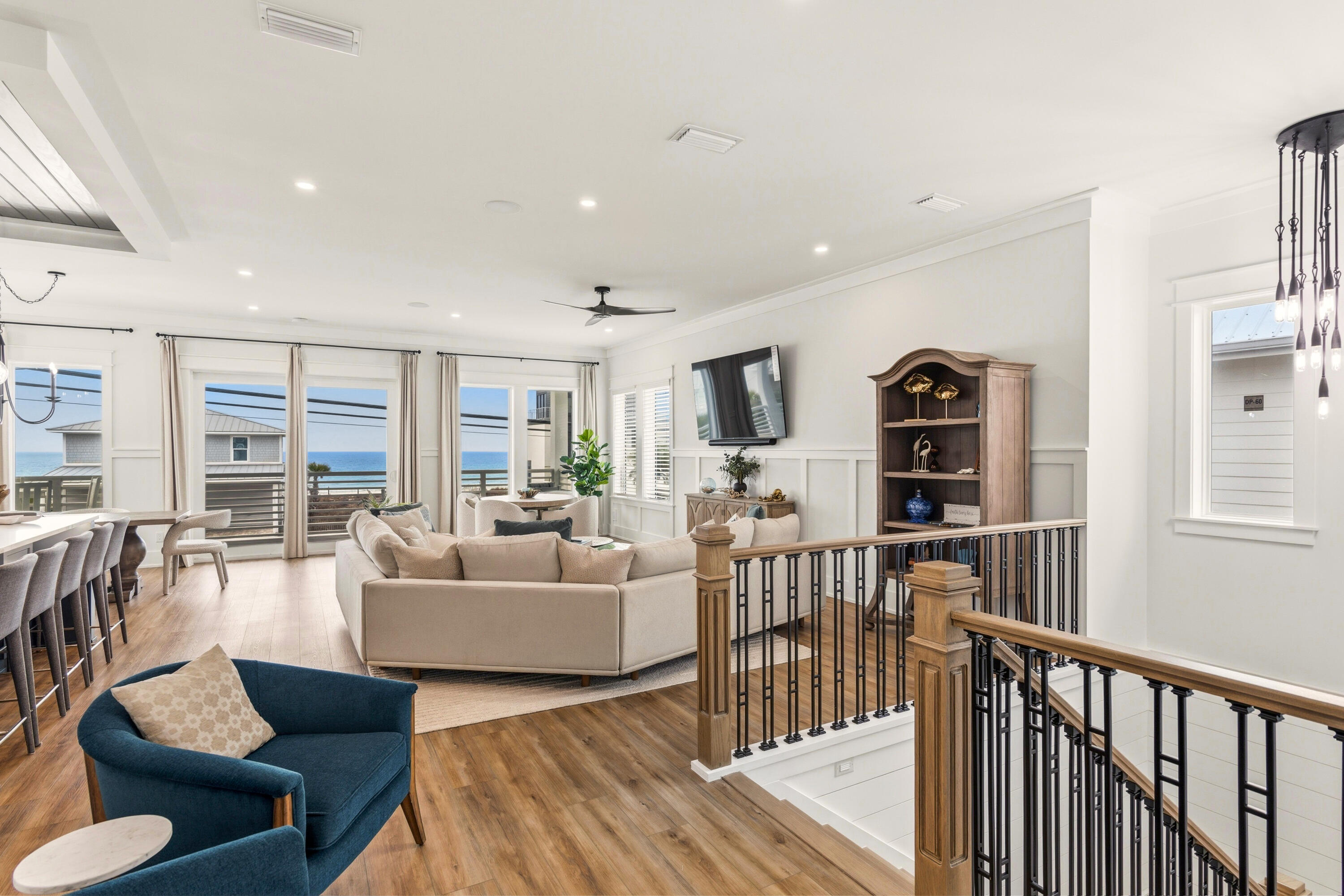 16416 Front Beach Road Panama City Beach, FL 32413 - Photo 5 of 46 a living room with furniture a rug a lamp and a large window