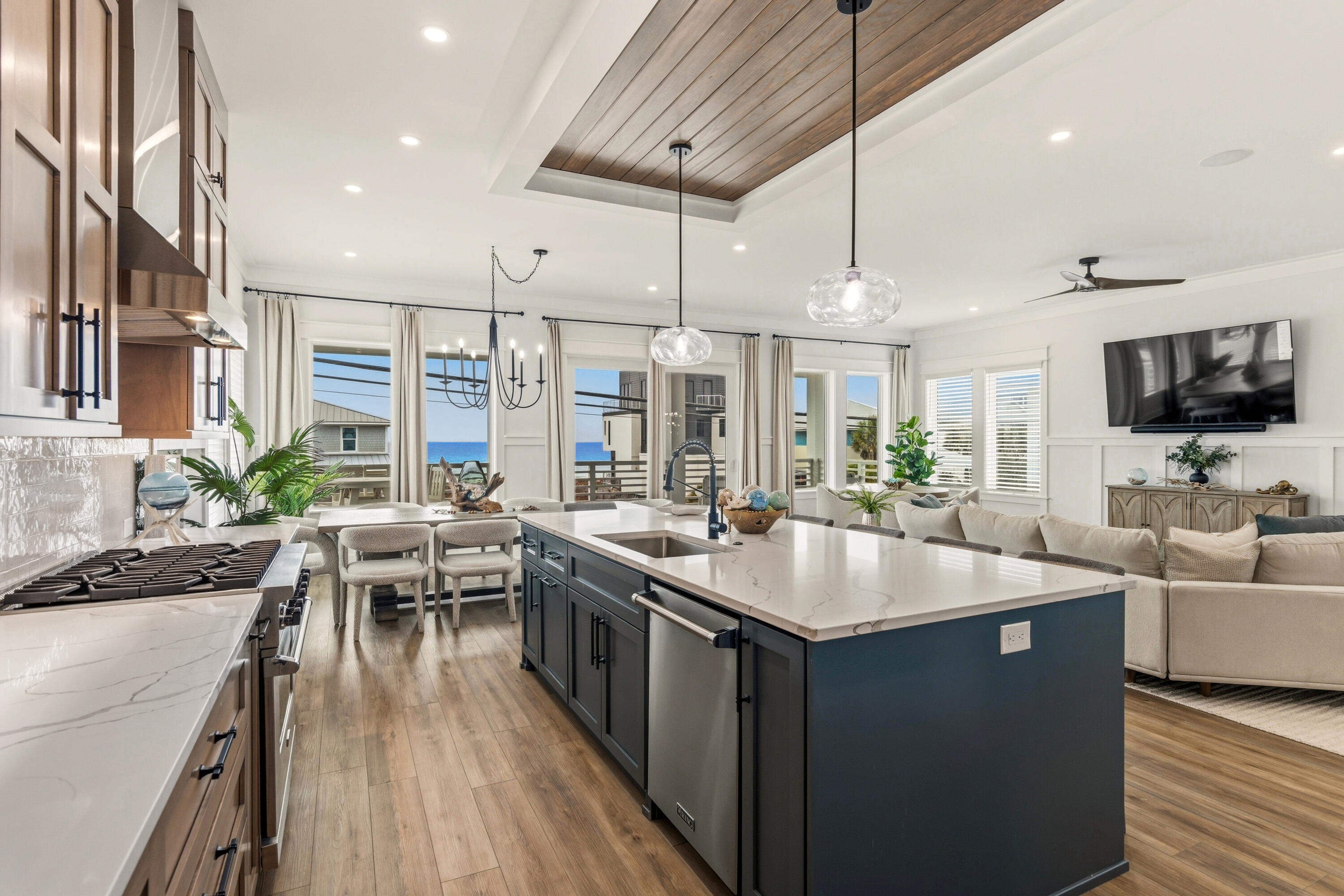 16416 Front Beach Road Panama City Beach, FL 32413 - Photo 9 of 46 a kitchen with stainless steel appliances granite countertop a sink and a stove top oven