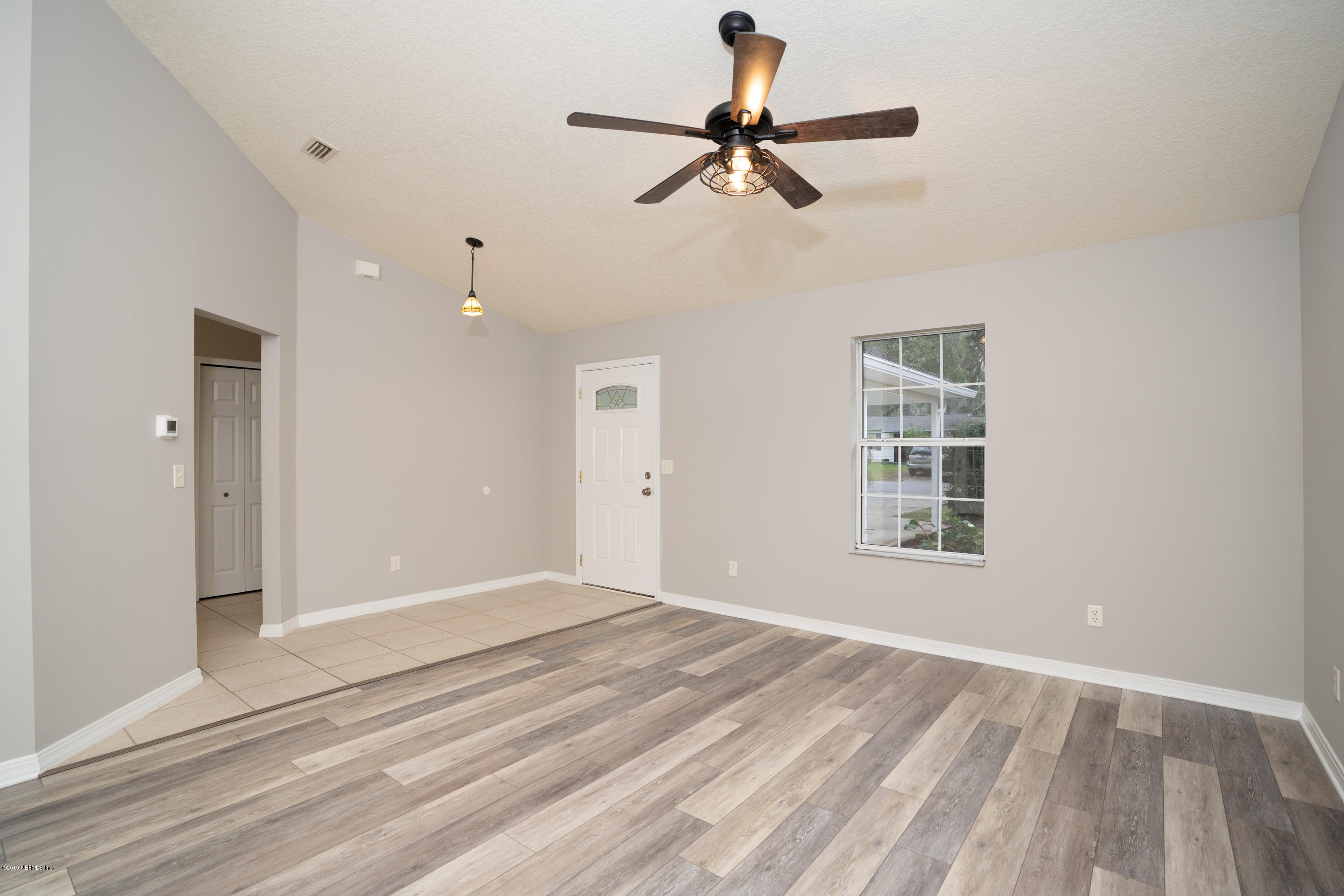 159 Hawthorne Road St. Augustine, FL 32086 - Photo 3 of 33 a view of a livingroom with a ceiling fan and window