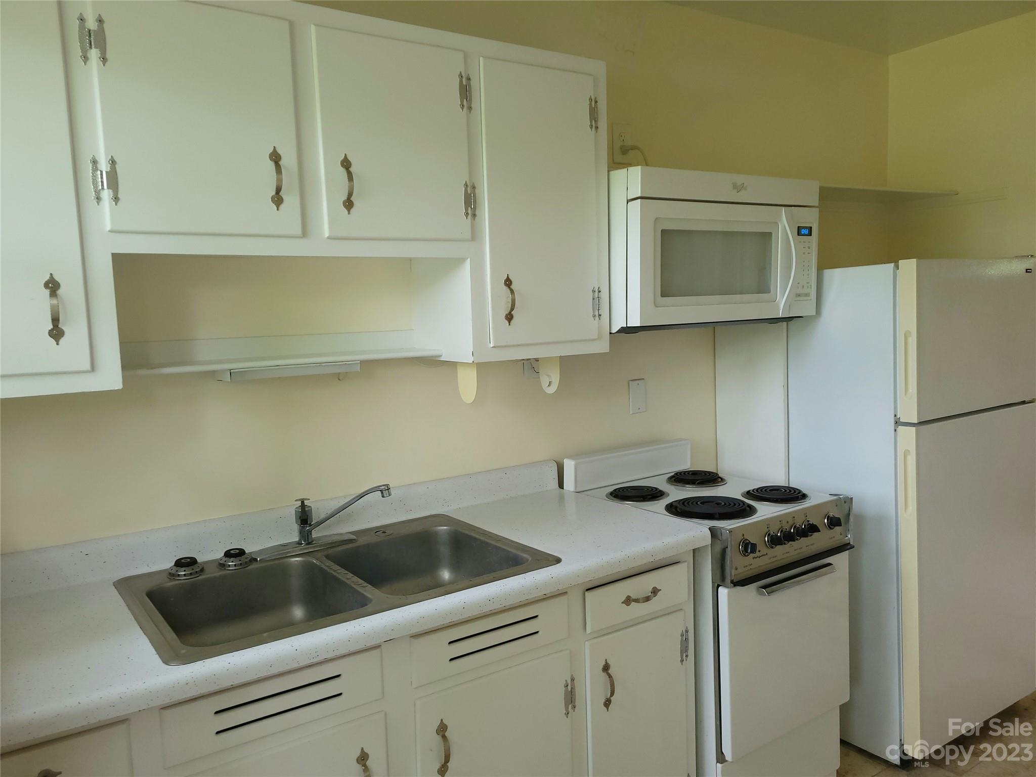 158 Elm Bend Road Brevard, NC 28712 - Photo 2 of 15 a kitchen with a sink cabinets and stainless steel appliances