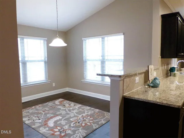 a bathroom with a sink a vanity and a mirror
