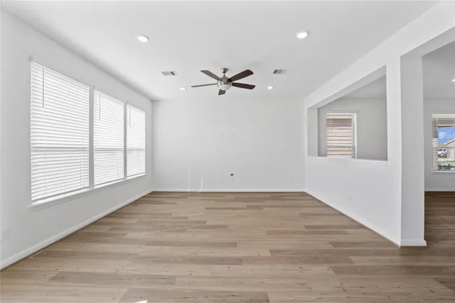 a view of a kitchen with a sink and a refrigerator