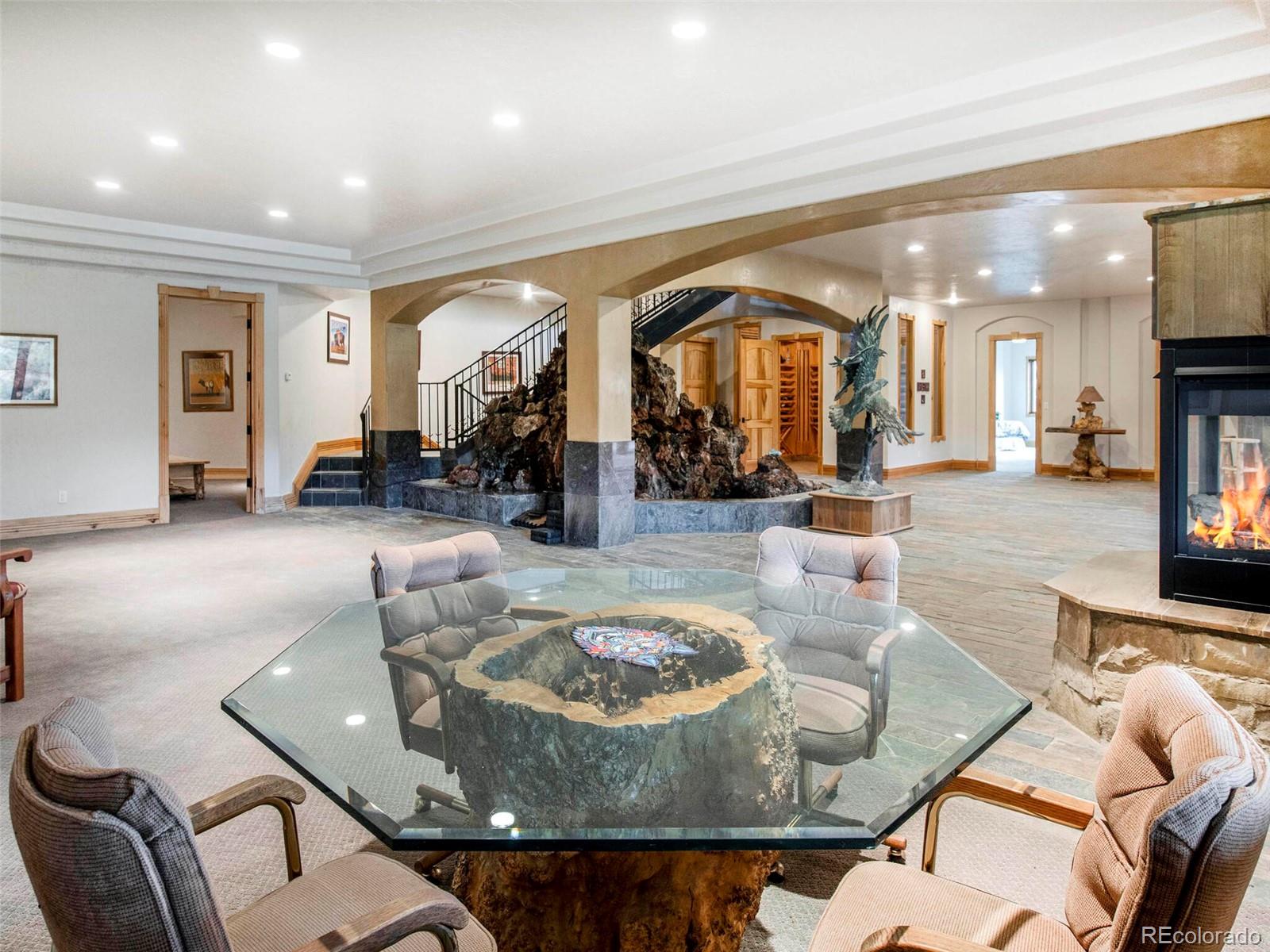 577 Bear Meadow Trail Evergreen, CO 80439 - Photo 25 of 40 a living room with furniture and a table