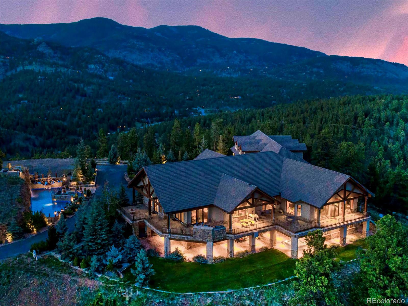 577 Bear Meadow Trail Evergreen, CO 80439 - Photo 39 of 40 a view of a house with a yard and outdoor seating