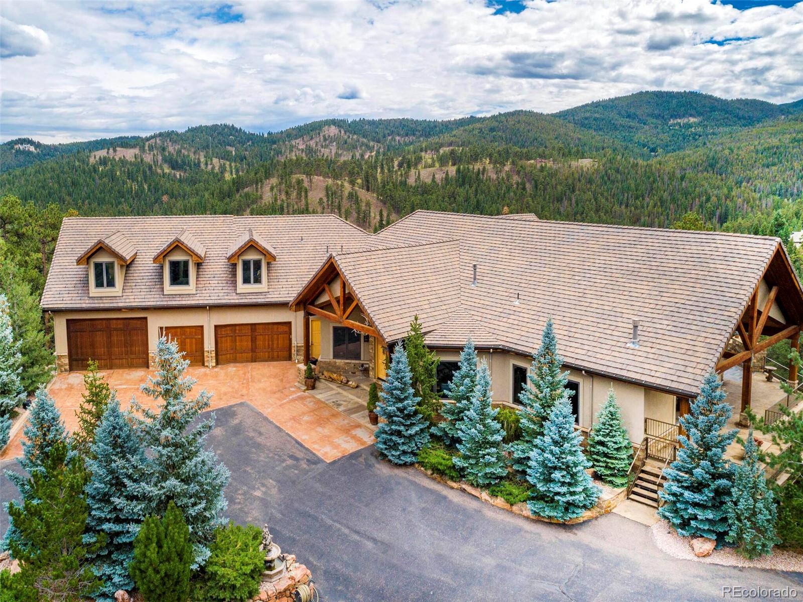 577 Bear Meadow Trail Evergreen, CO 80439 - Photo 40 of 40 an aerial view of a house with a yard