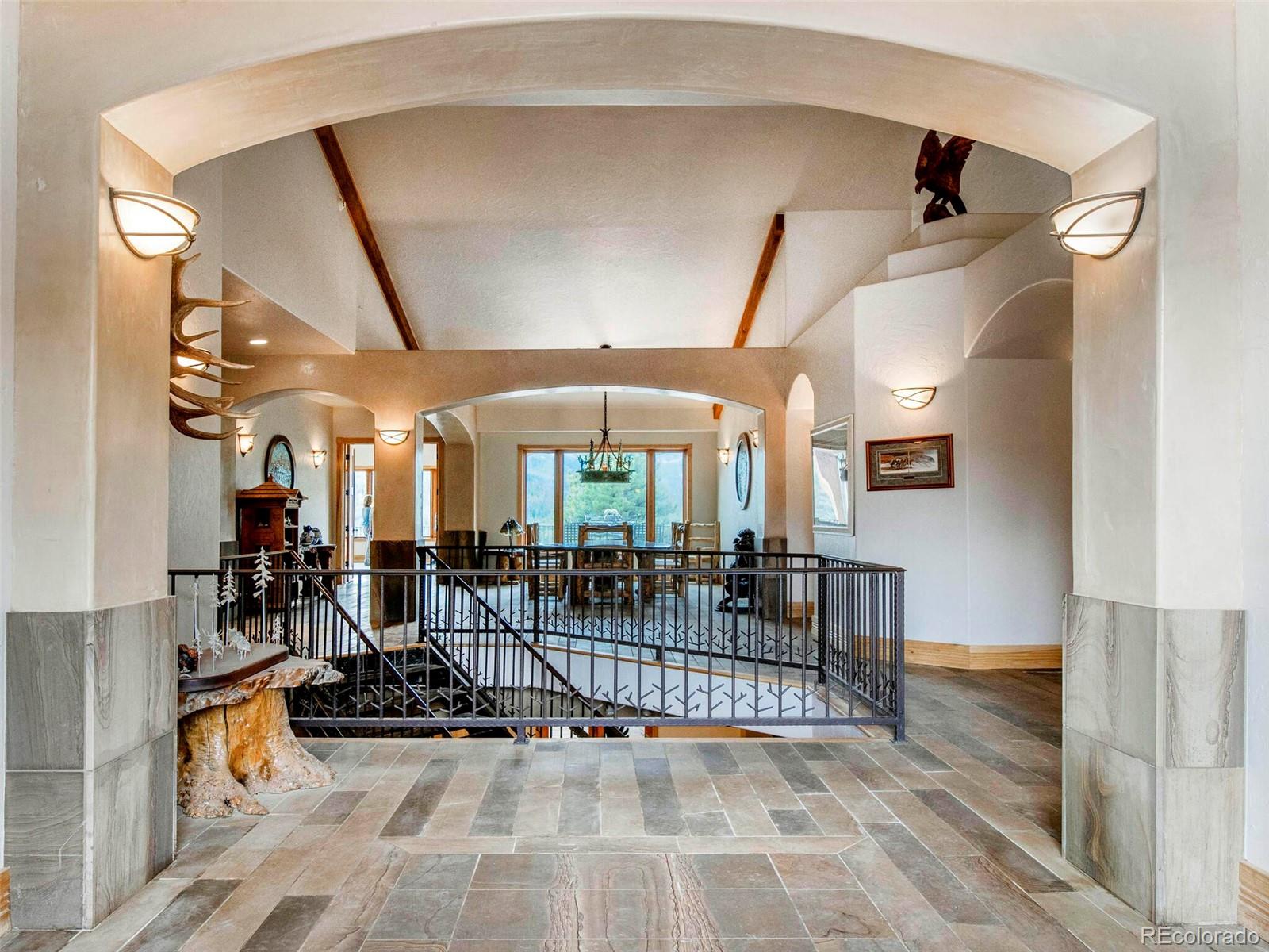 577 Bear Meadow Trail Evergreen, CO 80439 - Photo 5 of 40 a view of a livingroom with furniture and floor to ceiling window