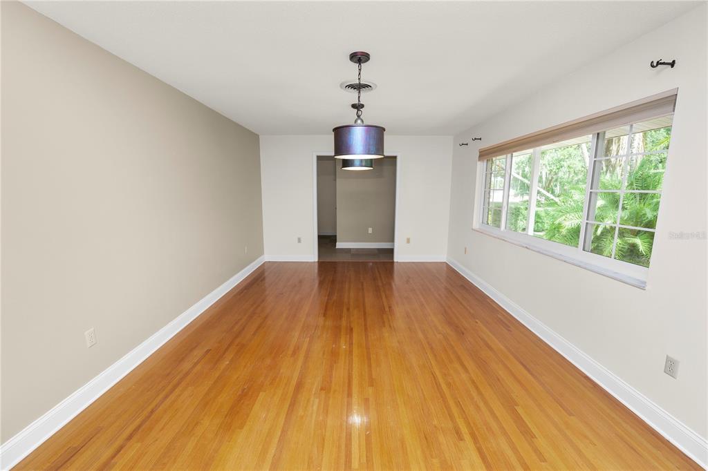 509 Robroy Street Lakeland, FL 33813 - Photo 15 of 51 a view of empty room with wooden floor and fan