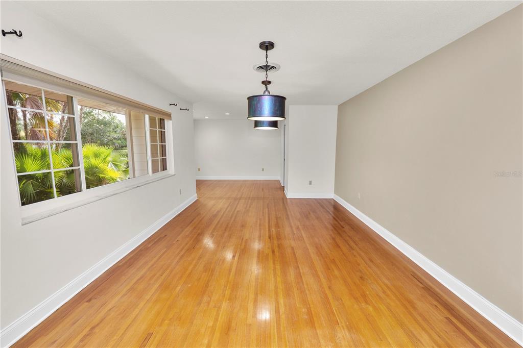 509 Robroy Street Lakeland, FL 33813 - Photo 16 of 51 a view of empty room with wooden floor and fan