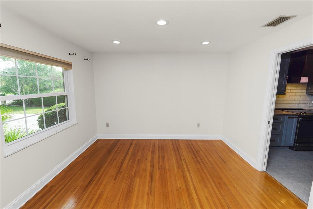 509 Robroy Street Lakeland, FL 33813 - Photo 21 of 51 a view of a room with wooden floor and a window