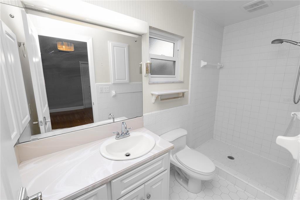 509 Robroy Street Lakeland, FL 33813 - Photo 30 of 51 a bathroom with a sink toilet and shower