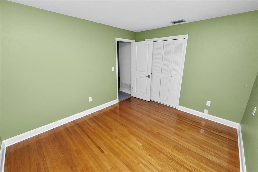 509 Robroy Street Lakeland, FL 33813 - Photo 31 of 51 a view of an empty room with wooden floor