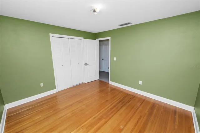 a bathroom with a sink and mirror with toilet