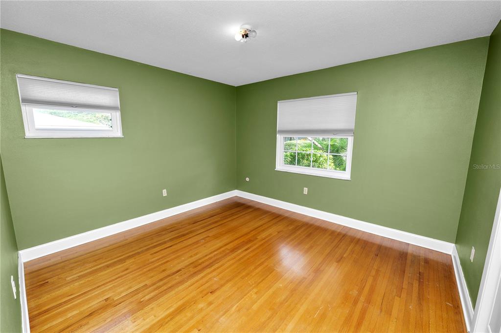 509 Robroy Street Lakeland, FL 33813 - Photo 34 of 51 a view of a big room with wooden floor and windows
