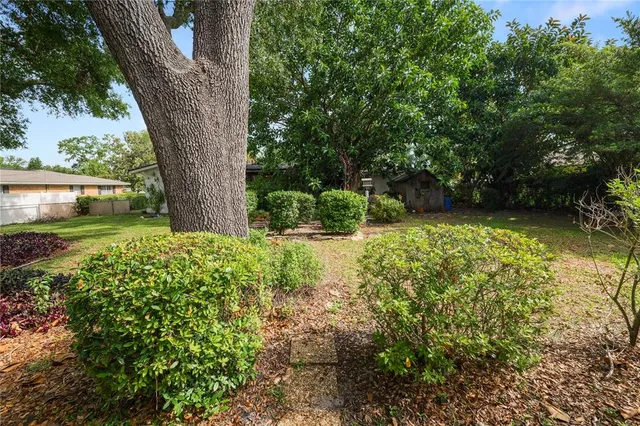 a view of a backyard with a sitting area and slide