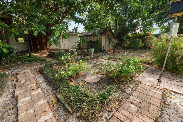 an aerial view of residential house with outdoor space