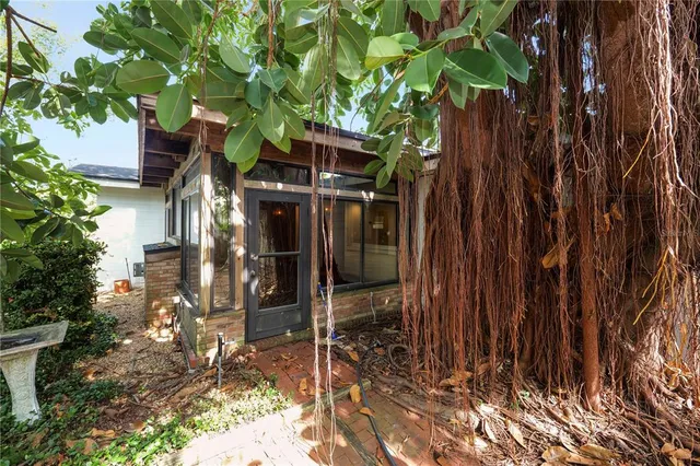 a view of a house with wooden fence