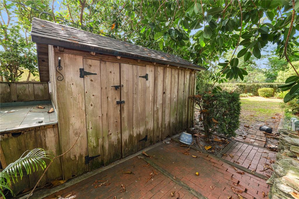 509 Robroy Street Lakeland, FL 33813 - Photo 45 of 51 a backyard of a house with table and chairs