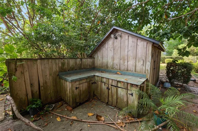 a backyard of a house with a yard fire pit and outdoor seating