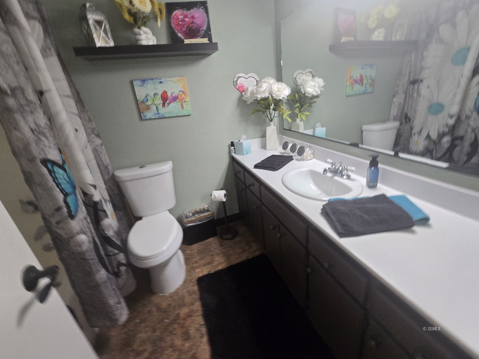 201 East Benson Avenue Ridgecrest, CA 93555 - Photo 13 of 35 a bathroom with a sink a vanity and toilet