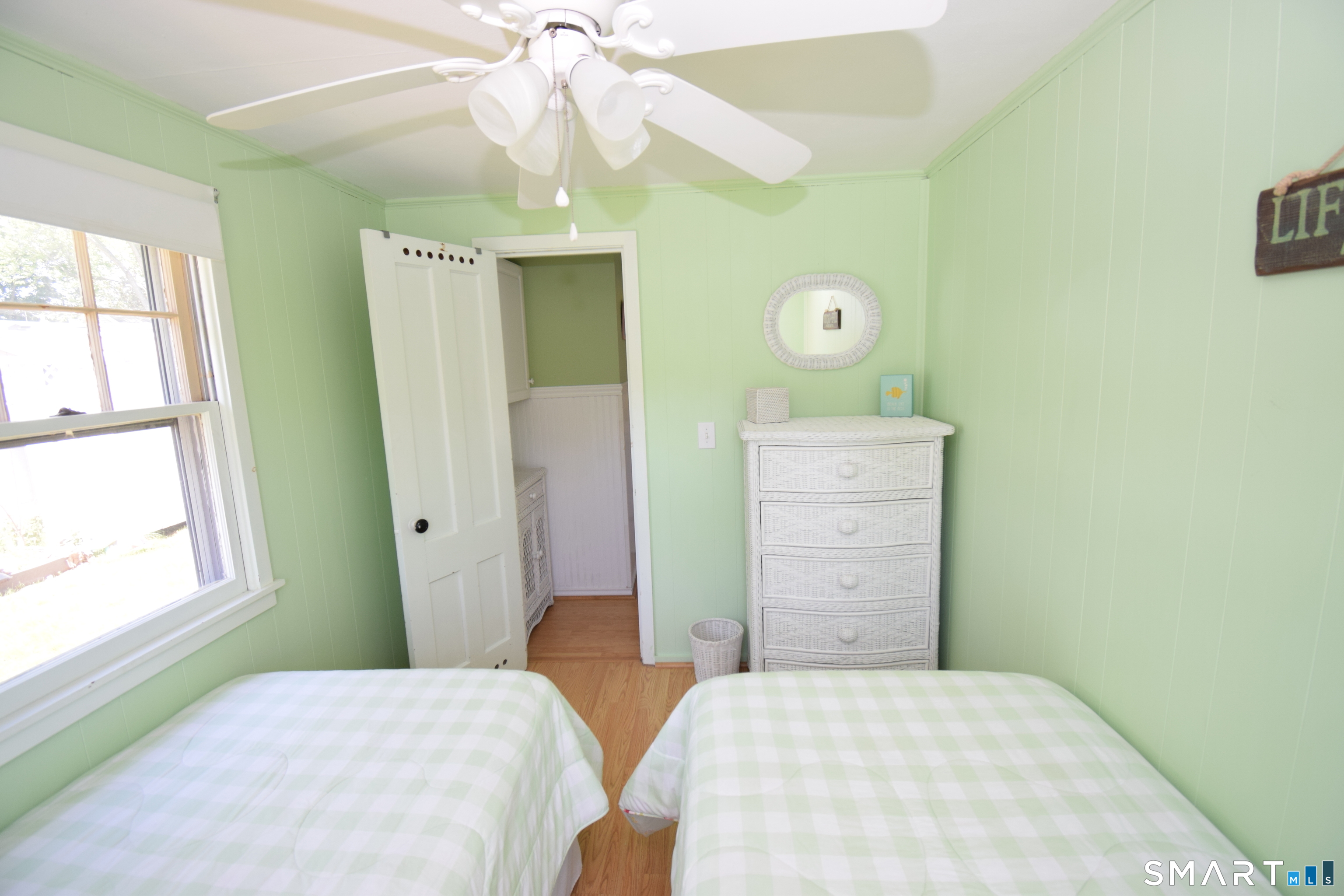 50 East Street Madison, CT 06443 - Photo 18 of 26 a bedroom with a bed and a window