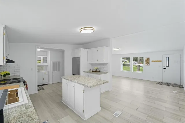 a kitchen with a stove and a sink