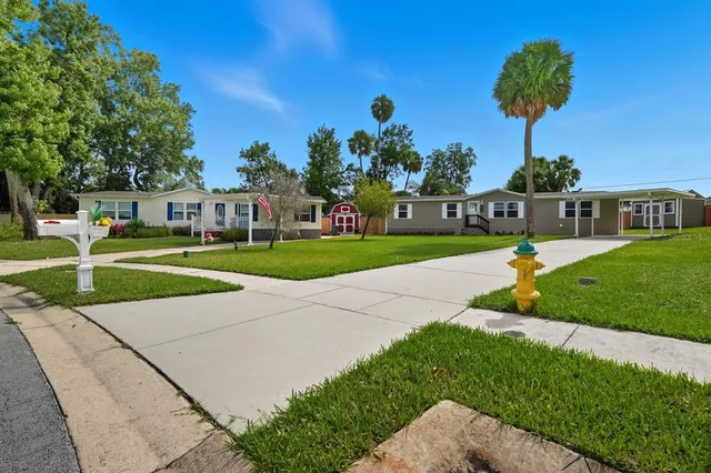 a view of a park with houses