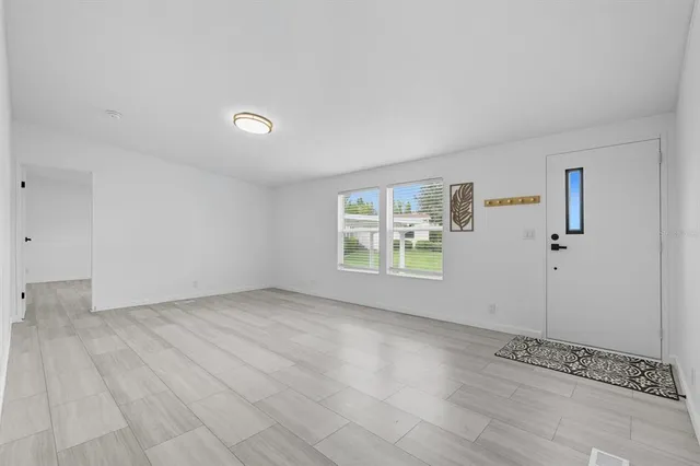 a view of an empty room with a window