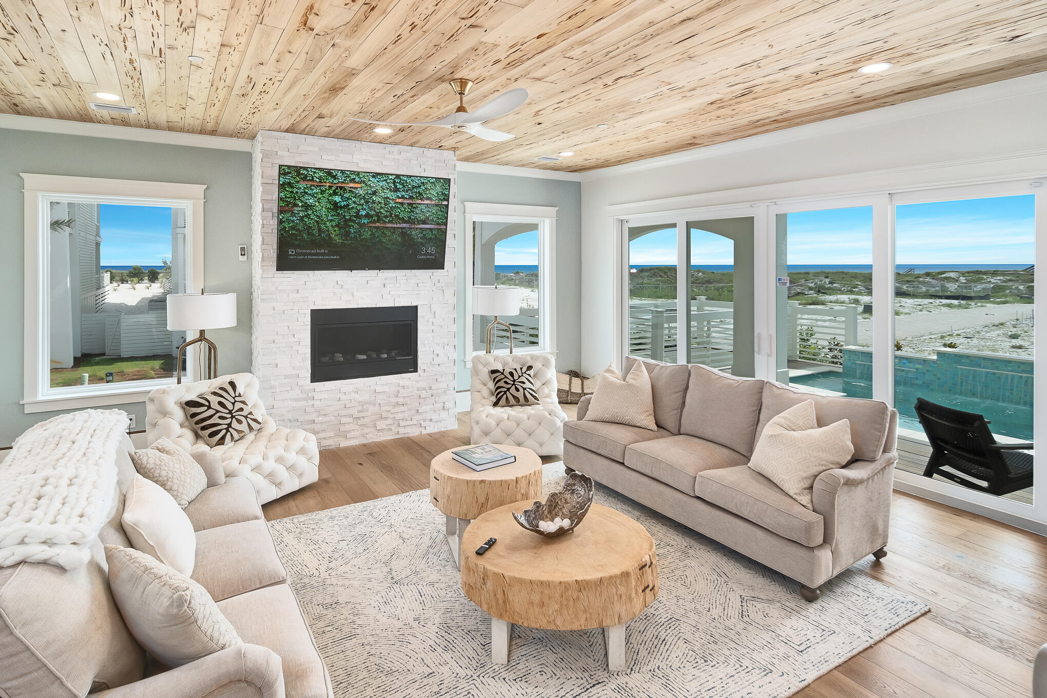 26 Palm Ct Lane Inlet Beach, FL 32461 - Photo 11 of 43 a living room with furniture a fireplace and a large window