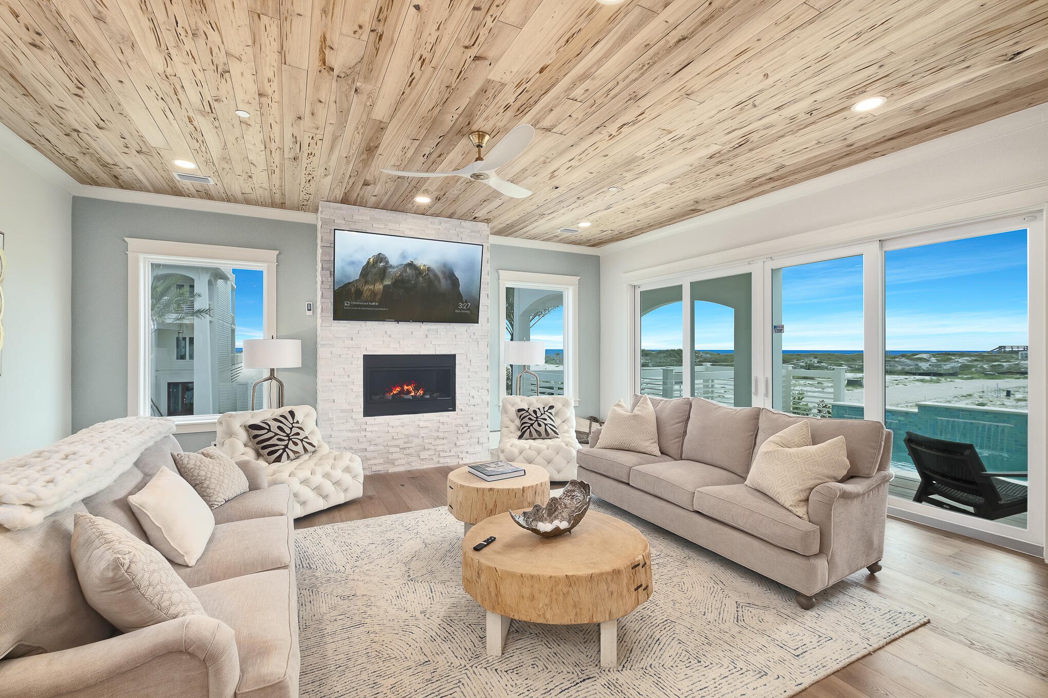 26 Palm Ct Lane Inlet Beach, FL 32461 - Photo 15 of 43 a living room with furniture a fireplace and a large window