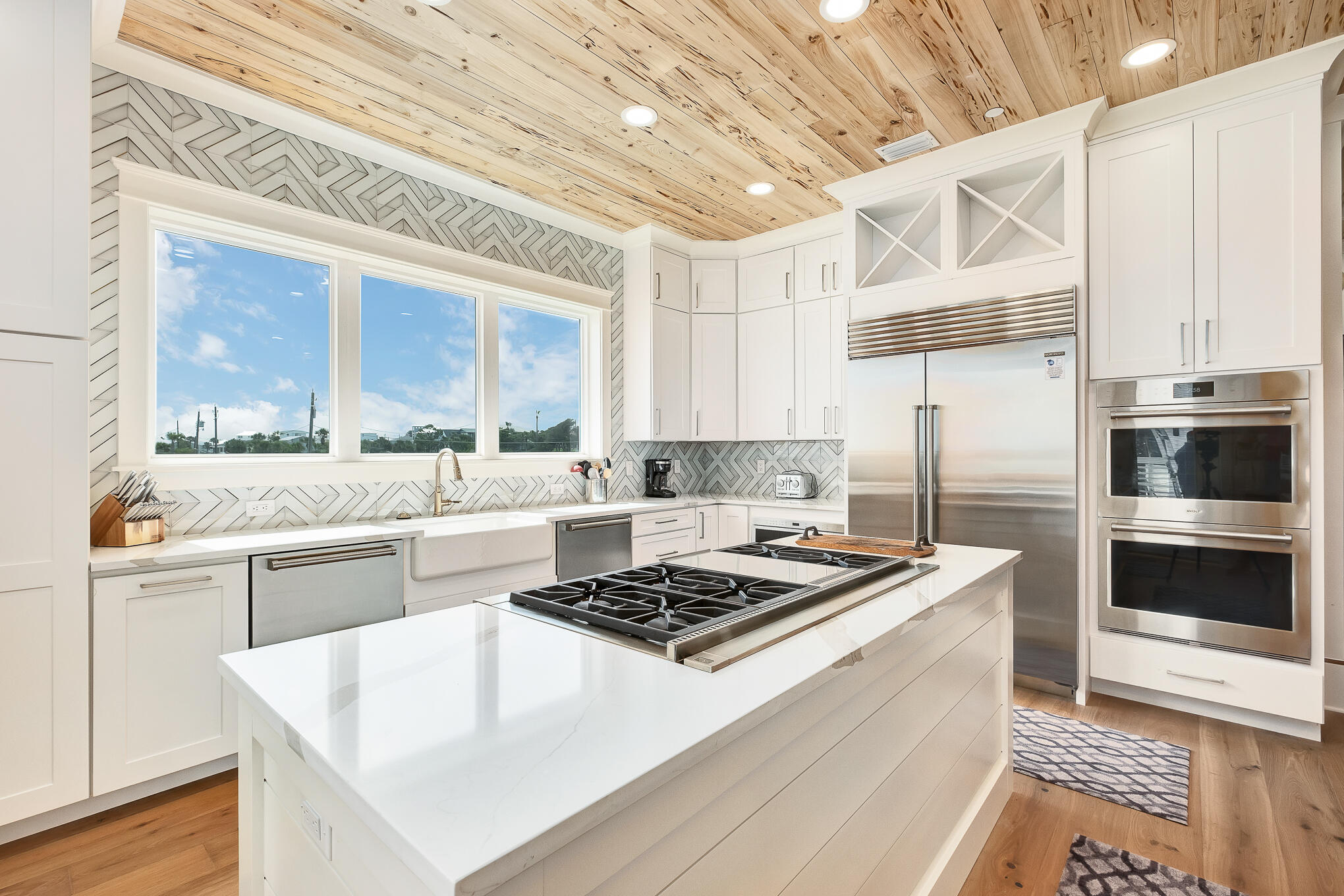 26 Palm Ct Lane Inlet Beach, FL 32461 - Photo 20 of 43 a kitchen with a stove a sink and a refrigerator