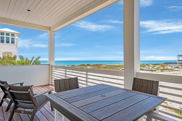 a view of a balcony with wooden floor