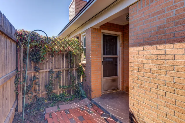 a view of a house with a door and wooden floor