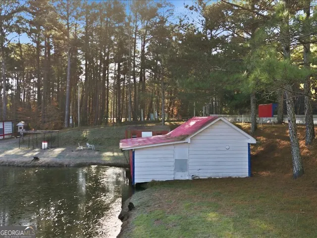 a small pool that has sitting area in front of it