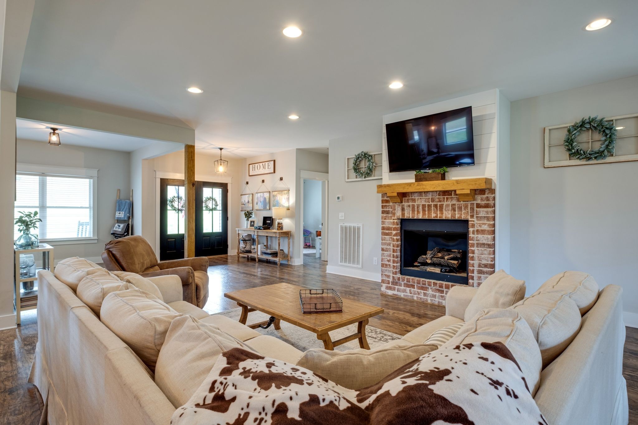 1227 Stayton Road Cumberland Furnace, TN 37051 - Photo 11 of 70 a living room with furniture a flat screen tv and a fireplace