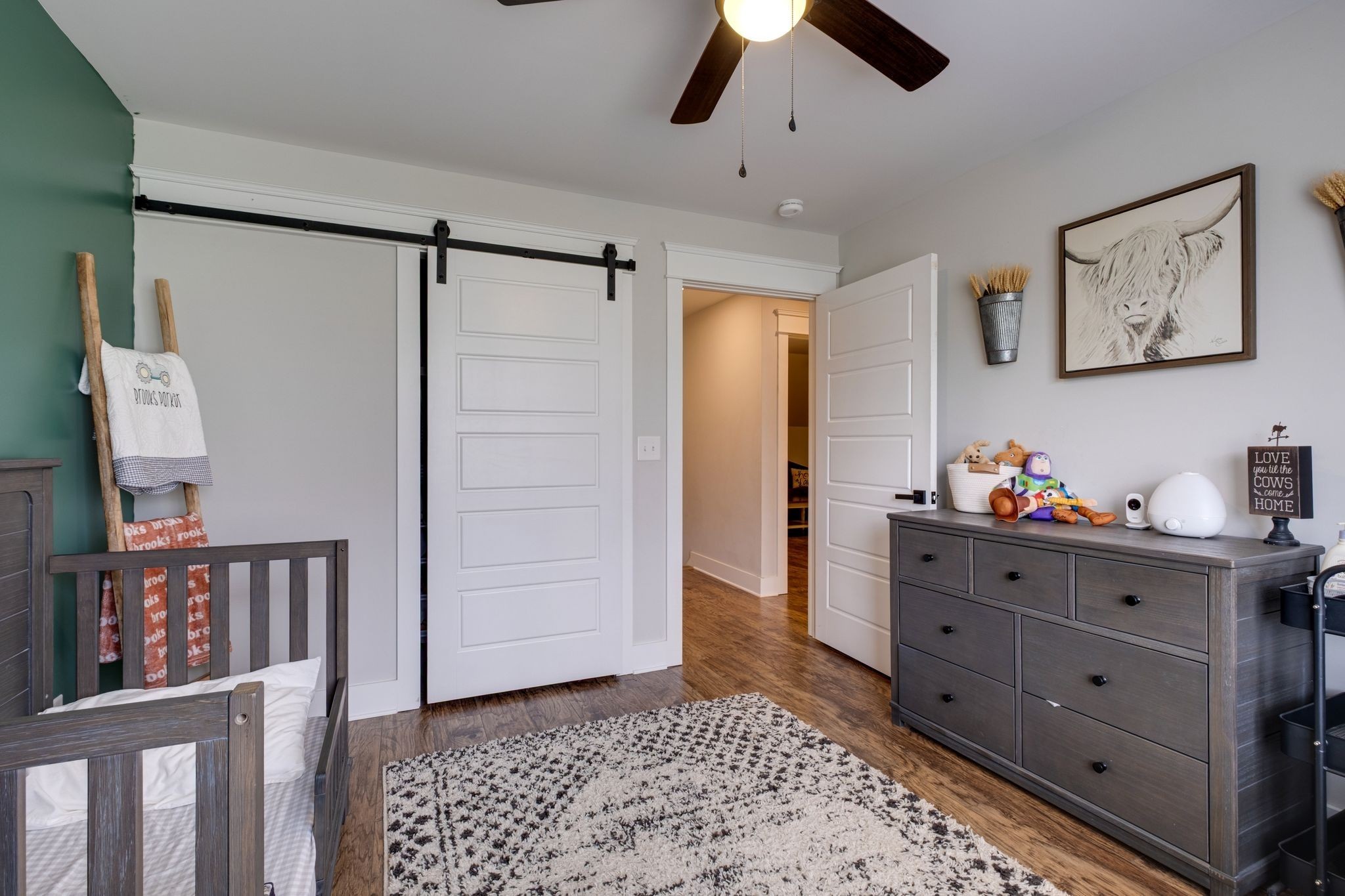 1227 Stayton Road Cumberland Furnace, TN 37051 - Photo 34 of 70 a room with a baby crib and dresser
