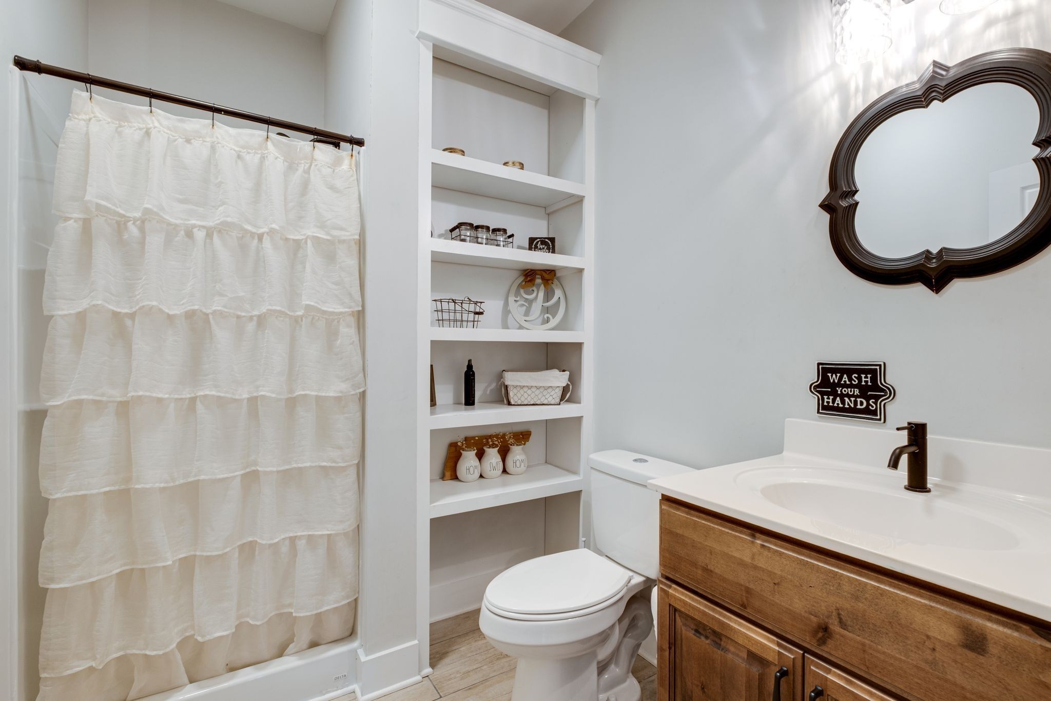 1227 Stayton Road Cumberland Furnace, TN 37051 - Photo 36 of 70 a bathroom with a sink a toilet and a mirror