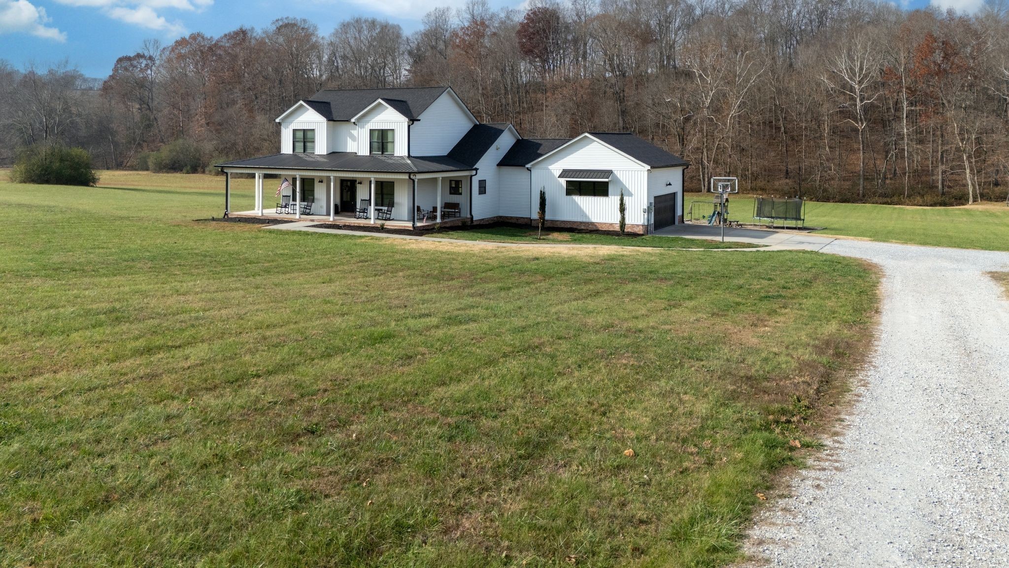 1227 Stayton Road Cumberland Furnace, TN 37051 - Photo 47 of 70 a white house with a big yard and large trees